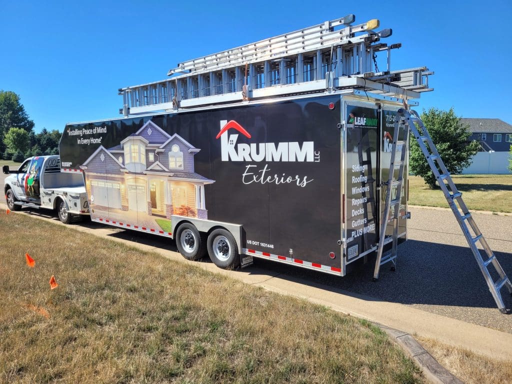 Krumm Exteriors branded enclosed trailer on gutter job in Wisconsin