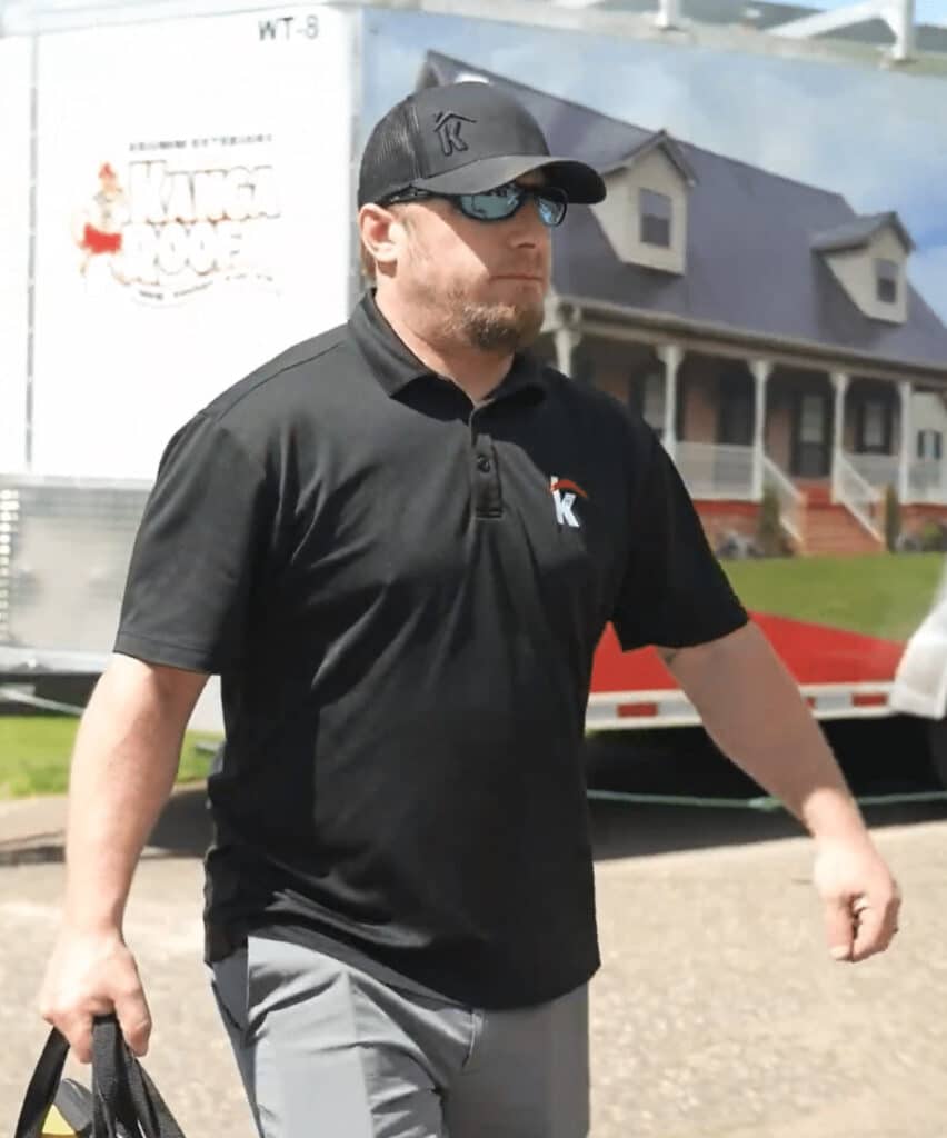 Krumm Exteriors Roofing Specialist Walking On Job Site