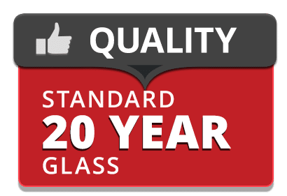 A sign with a thumbs-up icon and the word QUALITY on a dark background, above red text that reads STANDARD 20 YEAR GLASS.