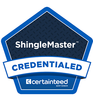 A blue and white badge with the text ShingleMaster Credentialed and the CertainTeed logo at the bottom, indicating a roofing certification.
