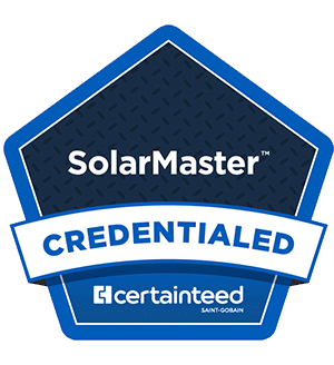 A blue and dark gray badge with the words SolarMaster CREDENTIALED and the CertainTeed Saint-Gobain logo at the bottom. The badge has a pentagon shape with a patterned background.