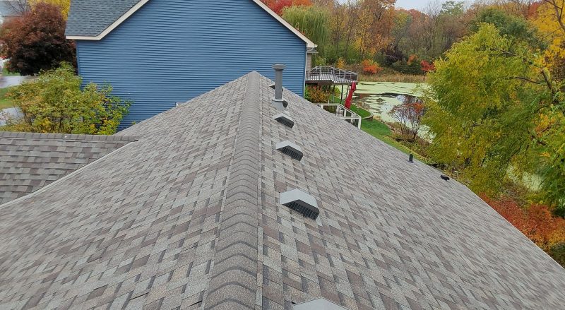 Asphalt roofing and seamless gutter installation in Hudson, WI