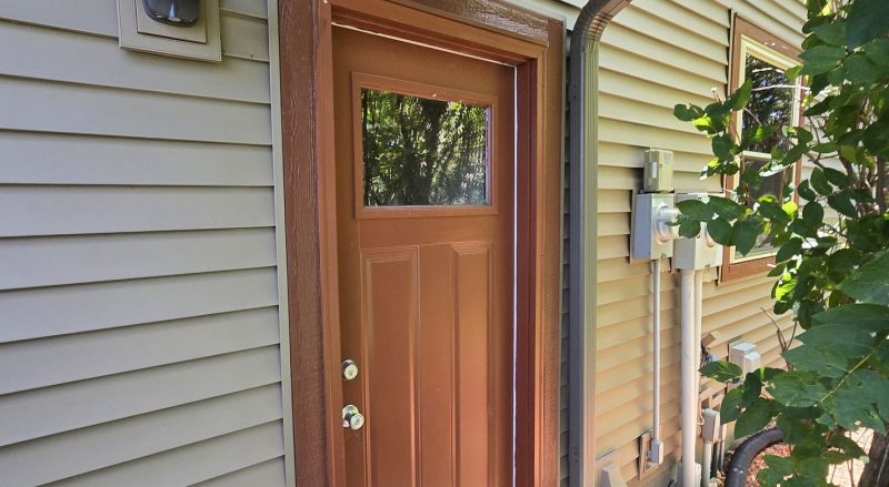 vinyl siding installation by door in new richmond, wi